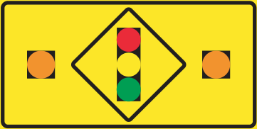 Alberta road sign: Stop at traffic lights ahead when yellow lights flashing